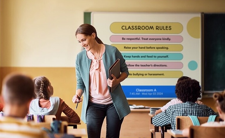 Teacher with digital signage in class